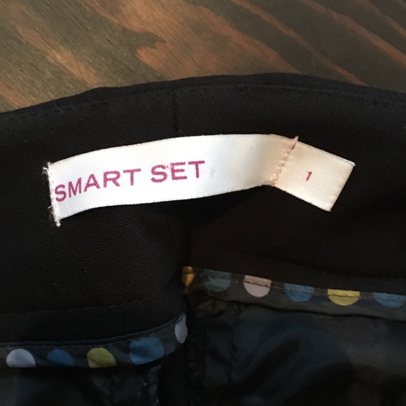 Black pant suit. Fitted jacket and straight leg pants with a slight boot cut. - Picture 4 of 10